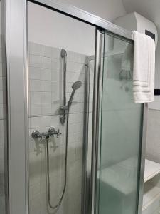 a shower with a glass door in a bathroom at Al Centro Storico in Catania