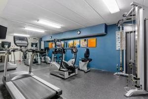 a gym with treadmills and machines in a room at Comfort Inn Herndon-Reston in Herndon