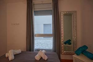 Postel nebo postele na pokoji v ubytování Canteras Suite Gran Canaria