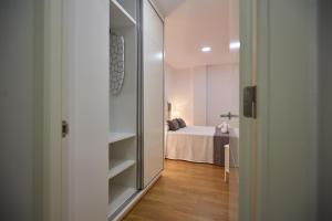 Postel nebo postele na pokoji v ubytování Canteras Suite Gran Canaria