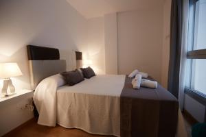 Postel nebo postele na pokoji v ubytování Canteras Suite Gran Canaria