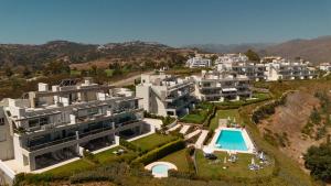 an aerial view of a resort with a swimming pool at Modern holiday apartment with incredible sea views in La Cala de Mijas in Málaga