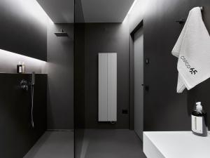 a bathroom with a shower and a white towel at Civico 65 Garda Holiday 19 in Arco