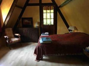 מיטה או מיטות בחדר ב-Chaumière Normandie