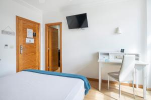 Кровать или кровати в номере Hotel Alda Puerta Del Sol