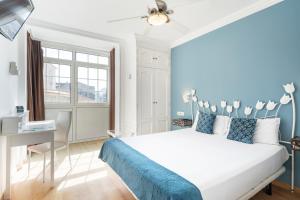 Кровать или кровати в номере Hotel Alda Puerta Del Sol