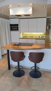 A cozinha ou kitchenette de BeautyD RED ROOM centrum Gullegem