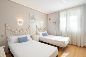 Кровать или кровати в номере Hotel Alda Puerta Del Sol