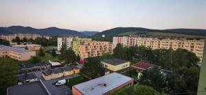 an aerial view of a city with buildings and mountains at PU Bývanie v súkromí s výhľadom na tichom mieste v PU in Púchov