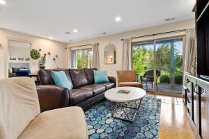 a living room with a couch and a table at Modern Bellingham Retreat Near Galbraith Mountain! in Bellingham