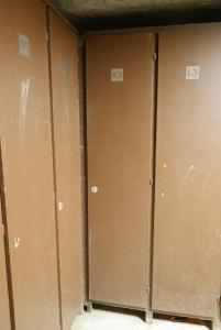 three brown lockers are lined up in a room at Appartement les 2 alpes 1800 départ /retour skis aux pieds in Les Deux Alpes