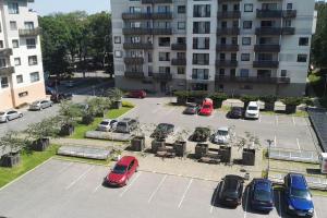 an aerial view of a parking lot in front of a building at Wonderful apartment for Families and more in Rīga