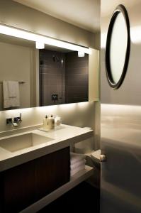 a bathroom with a sink and a mirror at Hotel Zetta San Francisco in San Francisco