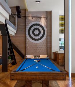 a pool table in a room with a target at Hotel Zetta San Francisco in San Francisco