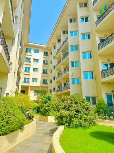 a large apartment building with a walkway in front of it at VIP Hostel - Females Only in Dubai