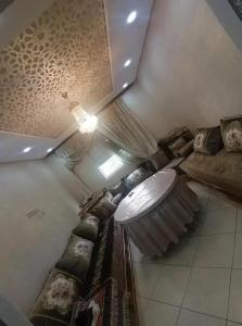 a room with a bunch of beds and a ceiling at Dayar arrid in Nador
