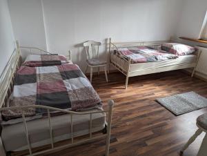 Ένα ή περισσότερα κρεβάτια σε δωμάτιο στο Gästehaus Gröpelingen