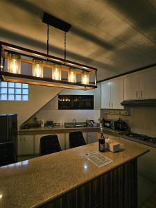 a kitchen with a large island with a counter top at Mirador Modern House - Walking distance to Lourdes Grotto in Baguio