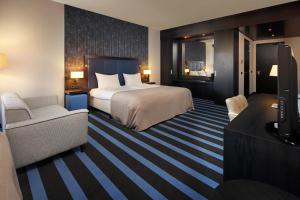 Postel nebo postele na pokoji v ubytování Van der Valk Hotel Sneek