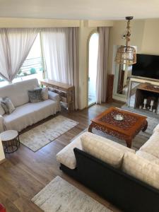 a living room with a couch and a table at Apartment Marbella House in Marbella