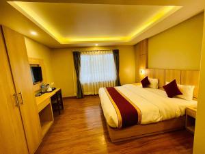 Ένα ή περισσότερα κρεβάτια σε δωμάτιο στο Hotel Aerocity