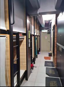 a hallway of a subway train with at BRICKS Backpackers Sleepbox in Tanah Rata