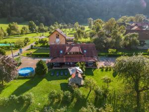 an aerial view of a house on a green field at Holiday Home Došen in Vrbovsko