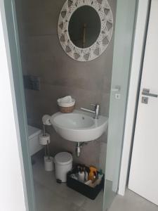 a bathroom with a sink and a mirror at Space Zen in Valença +19 photos
