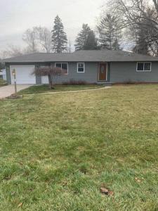 a house with a yard with a yard at Cute house in quiet neighborhood in Saginaw