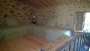 a bedroom with a bed and a window at Maison traditionnelle catalane avec jardin 