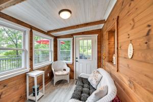 a living room with a couch and two chairs at Our Lakeside Retreat with Deck on Lake Herrington! in Bushtown