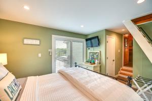 a bedroom with a bed and a sliding glass door at Our Lakeside Retreat with Deck on Lake Herrington! in Bushtown