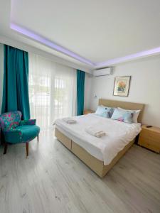 Postel nebo postele na pokoji v ubytování Mercan Otel