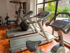 a gym with two tread machines and a treadmill at Carlson Hotel, Osborne Foreshore Phase 2, Ikoyi in Lagos