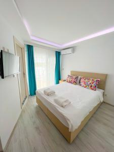 Postel nebo postele na pokoji v ubytování Mercan Otel