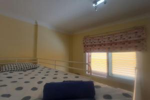 Cama o camas de una habitación en Apartment with view, wifi and pool in Arguineguin