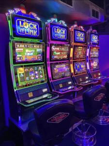 a bunch of slot machines in a casino at Le Platinium Barachois in Saint-Denis