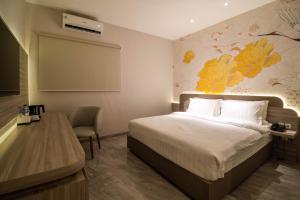 Yulia Hotel Managed by HIG客房内的一张或多张床位