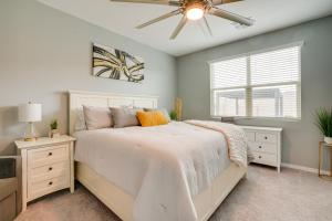 a bedroom with a bed and a ceiling fan at Buckeye Verrado Area Home with Pergola and Fire Pit in Litchfield Park