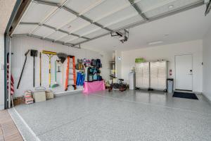 a large room with a garage with a lot of gear at Buckeye Verrado Area Home with Pergola and Fire Pit in Litchfield Park