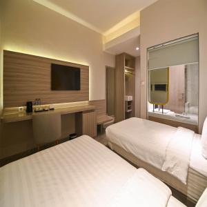 Yulia Hotel Managed by HIG客房内的一张或多张床位