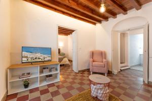 Télévision ou salle de divertissement dans l'établissement La Casita Beneroso