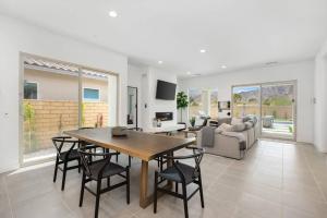 a living room with a table and chairs and a couch at PGA WEST New Pool & Spa Home in La Quinta