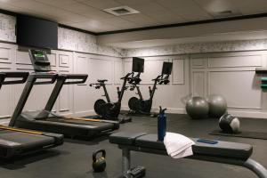 a gym with cardio machines and exercise bikes at The Arcadian powered by Sonder in Brookline