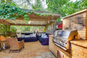 an outdoor patio with a grill and a couch at Rapid City Vacation Rental Near Park and Hiking! in Rapid City