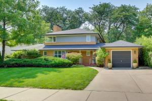 a house with a garage and a driveway at Rapid City Home Near Parks and Hiking! in Rapid City