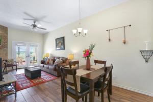 a living room with a table and a couch at Cozy Glimmer in Canyon Lake