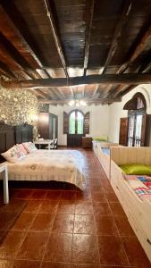 a large bedroom with two beds and a table at Centro de Asturias in Collado