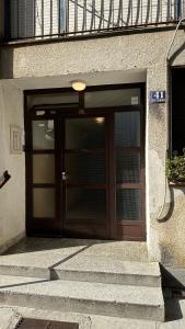 a large door to a building with stairs in front at Beautiful apartment Lena in Split