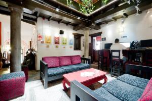 a living room with a couch and a table at Oasis Backpackers' Hostel Granada in Granada